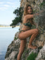 A girl wearing the Amarelle bikini, embracing the beach vibes and the vibrant patterns of her swimsuit while enjoying the refreshing ocean breeze